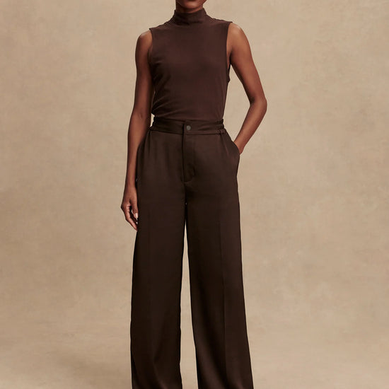 wide leg elasticated waist chocolate brown sateen trousers model shot