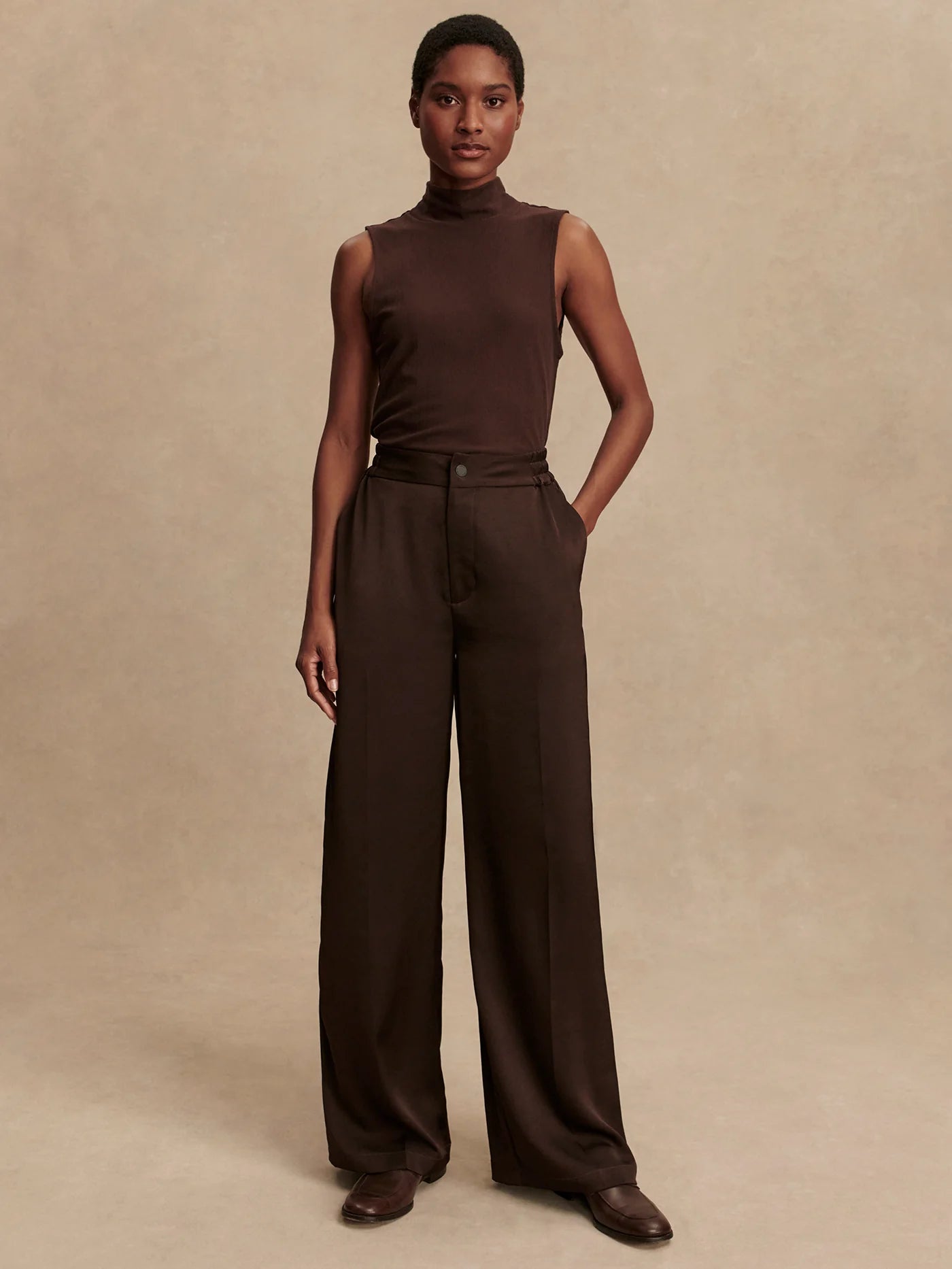 wide leg elasticated waist chocolate brown sateen trousers model shot