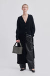 Long black cardigan with V neck. and button fastening