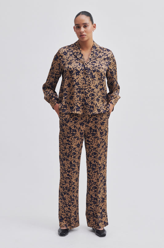 Navy and bronze floral print wide leg trousers with side slant pockets 