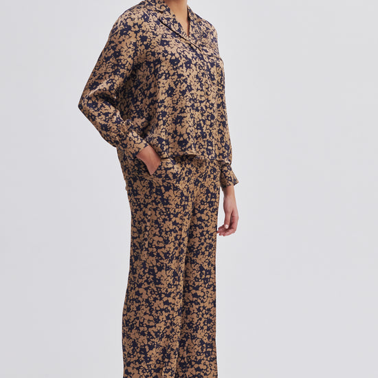 Navy and bronze floral print wide leg trousers with side slant pockets 