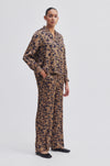 Navy and bronze floral print wide leg trousers with side slant pockets 