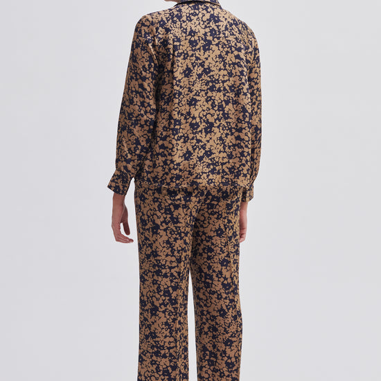 Navy and bronze floral print wide leg trousers with side slant pockets 