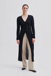 Black V neck skinning rib cardigan with long sleeves and ladder stitch detail