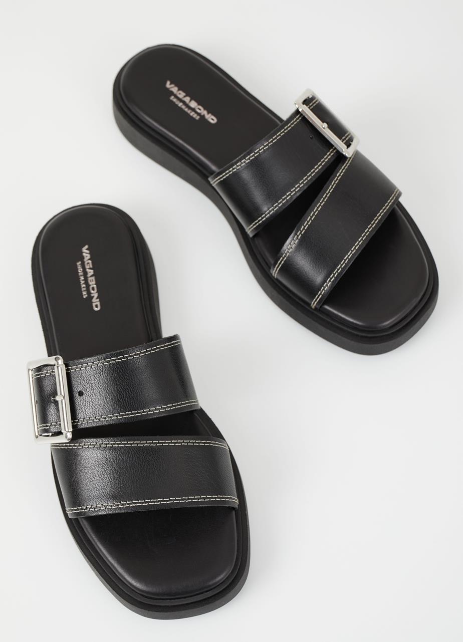 Black leather slider with white stitching and large silver toned buckle