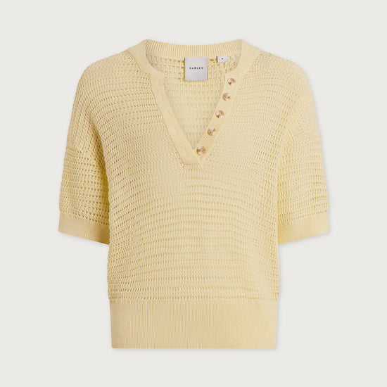 Yellow textured sweater on a light gray background