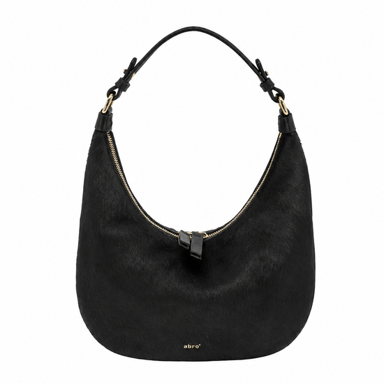 A black hobo shoulder bag with a curved silhouette, featuring a top zipper, a single shoulder strap, and a small gold logo on the front, set against a plain white background.