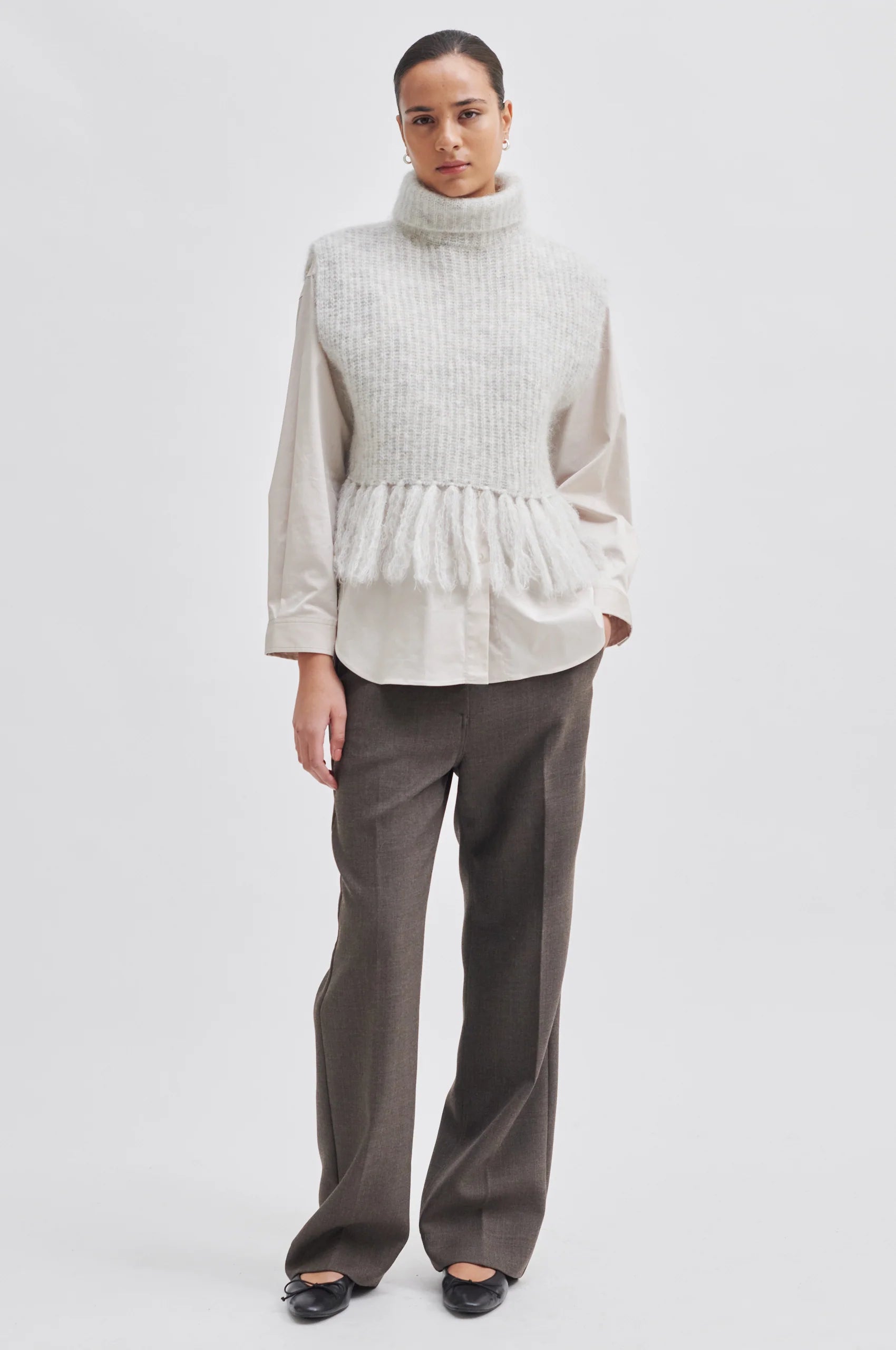 Light grey turtleneck knit with fringe hem