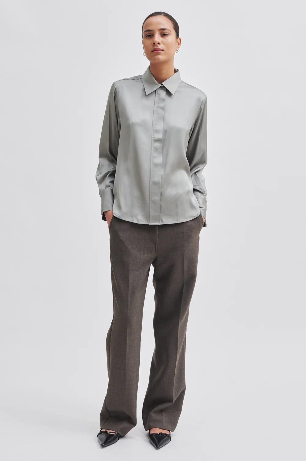 Light grey green satin shirt with classic collar hidden placket long sleeves and rounded dropped hem