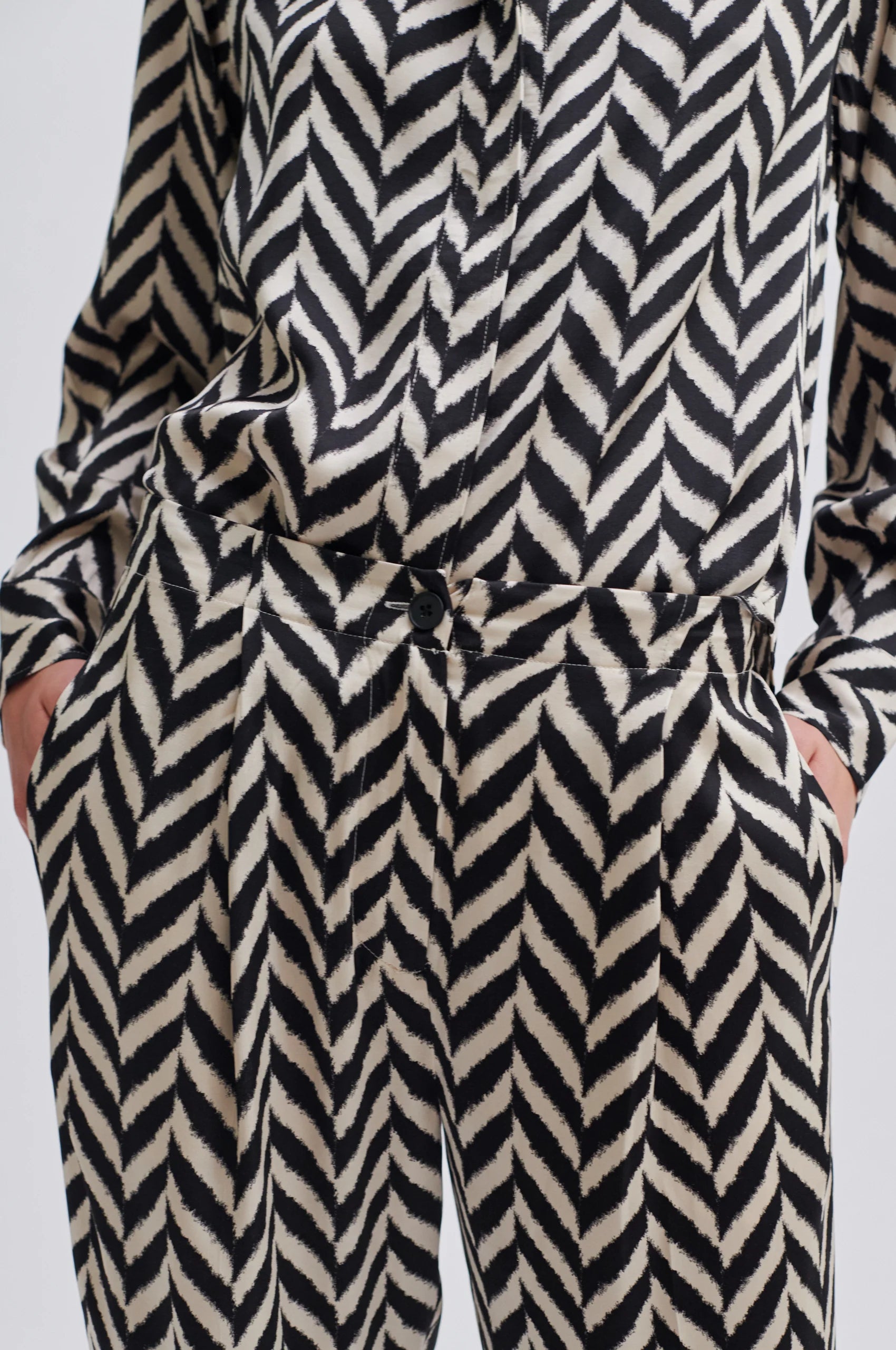 Wide leg trousers in a black and cream chevron print