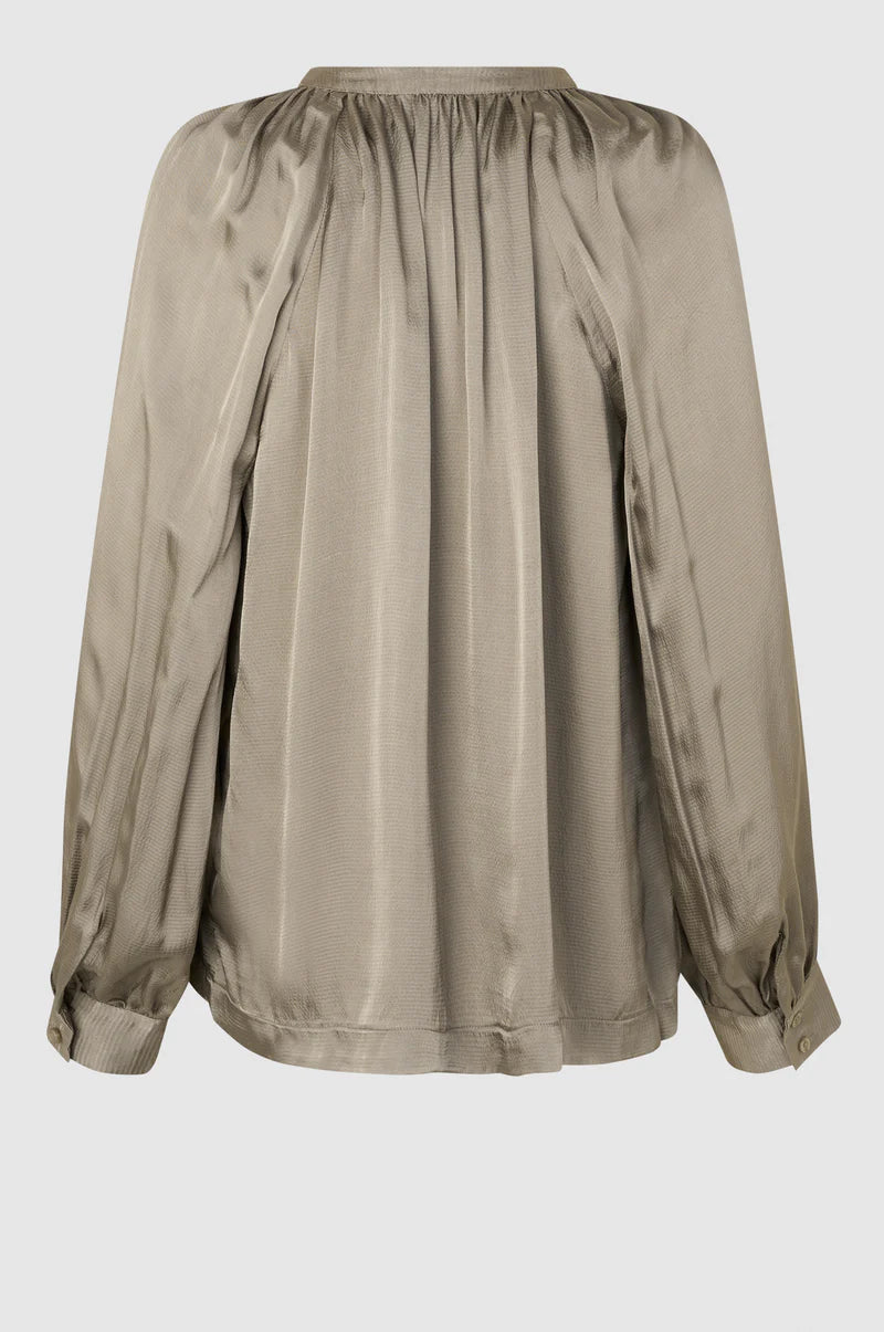 Taupe textured satin pull on top with long sleeves and gathered notch neck