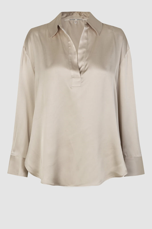 Satin ivory notch neck pull on top with long sleeves and a classic collar