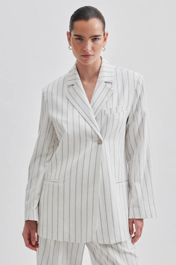 Off white single breasted blazer with generous overlap long sleeves and single silver button fastening with contrast stripe