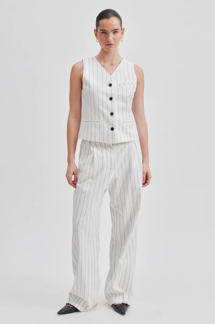 Off white V neck waistcoat with pinstripe and contrast black buttons