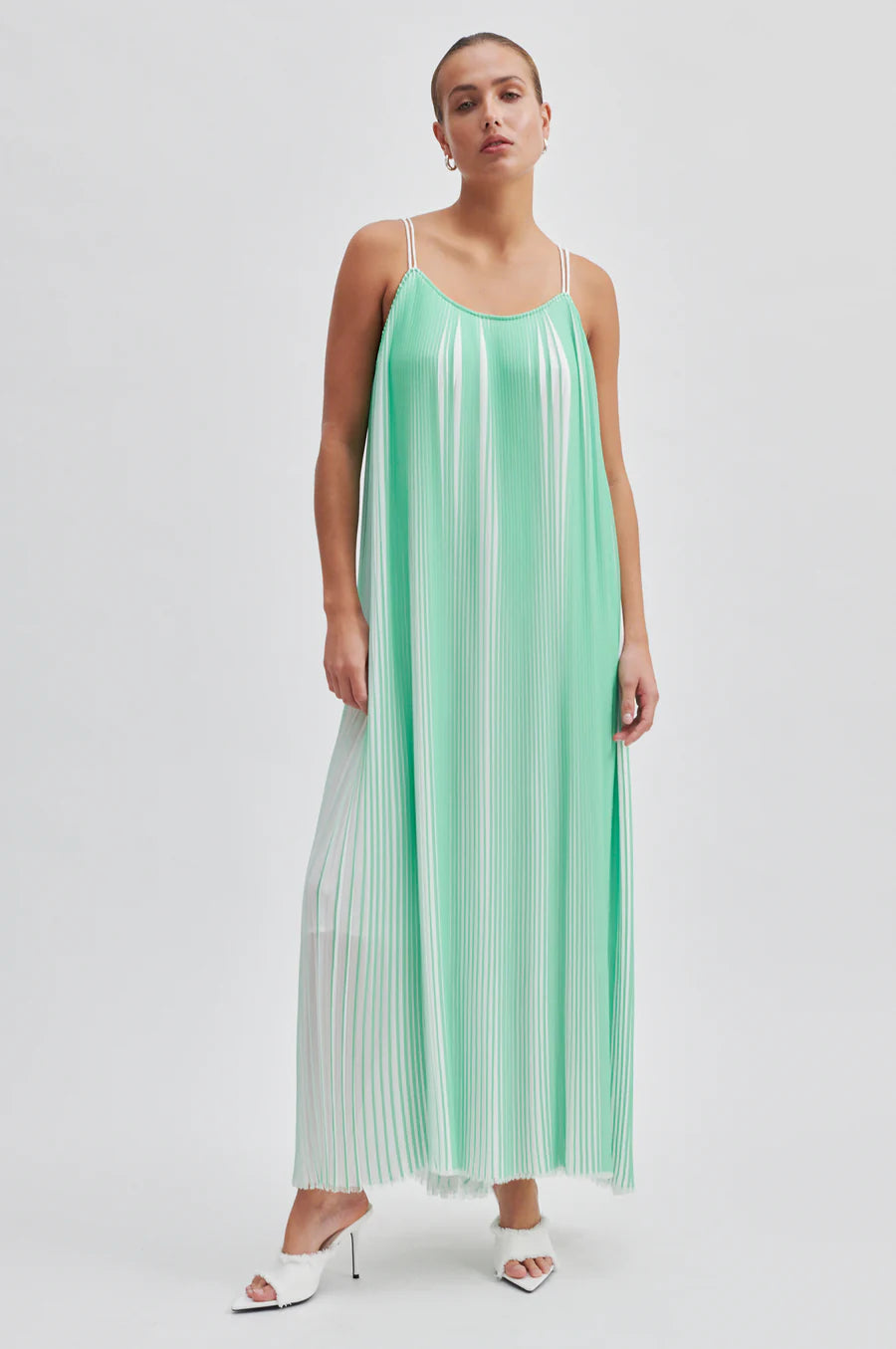 Green and white plisse swing dress with thin double white straps that cross over at the back long midi length