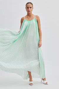 Green and white plisse swing dress with thin double white straps that cross over at the back long midi length