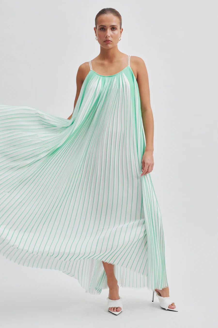 Green and white plisse swing dress with thin double white straps that cross over at the back long midi length