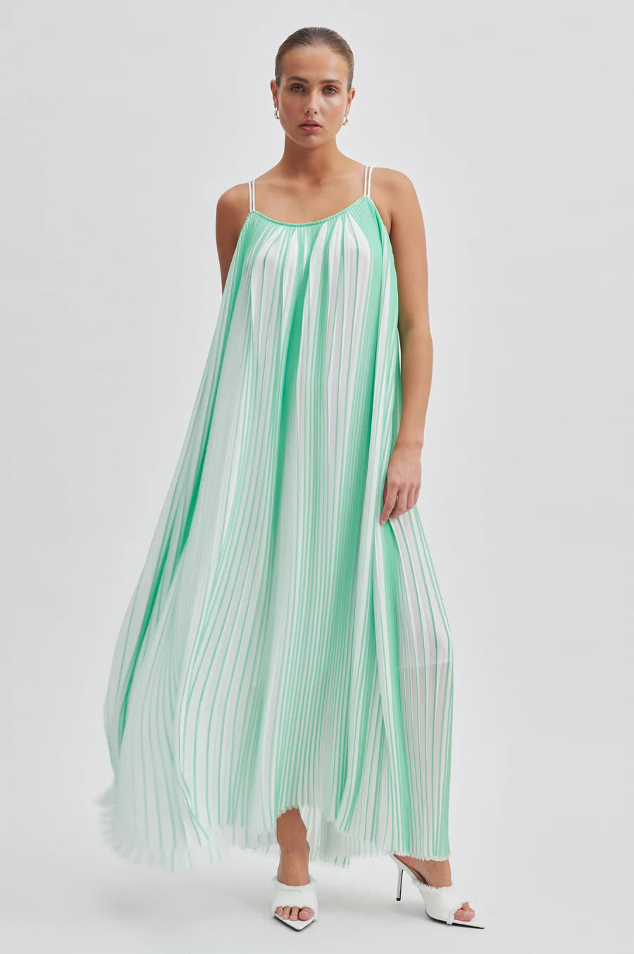 Green and white plisse swing dress with thin double white straps that cross over at the back long midi length