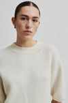 off white jumper with o neck and 3/4 sleeves