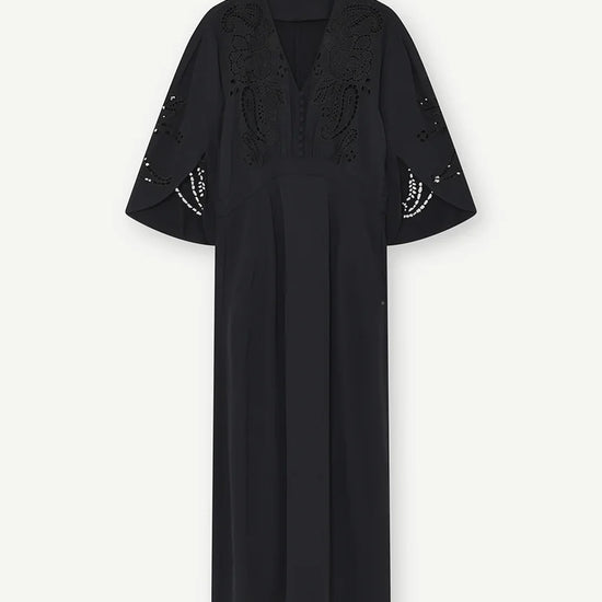 Black dress with floral embroidery on a white background