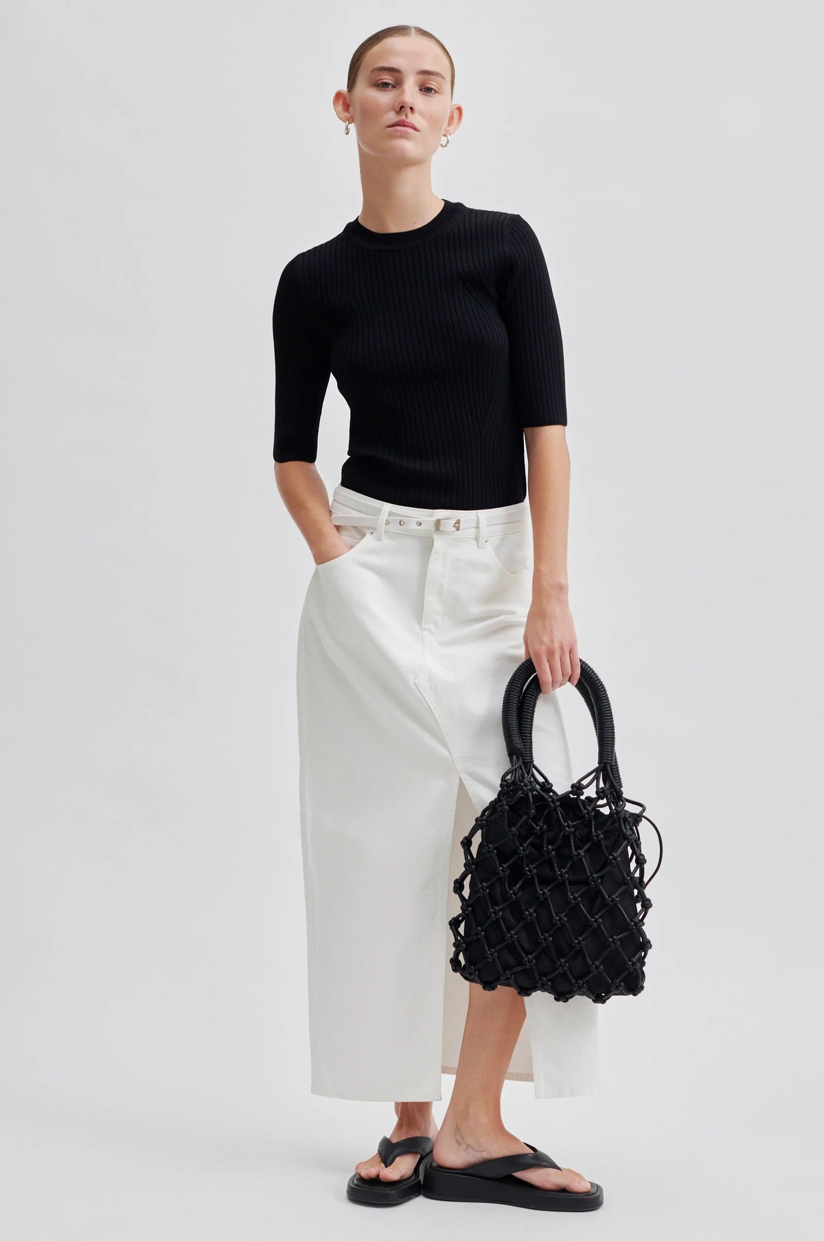 Black crochet bag with a cotton liner