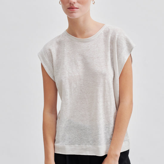 white t-shirt with deep arm holes and round neck model shot