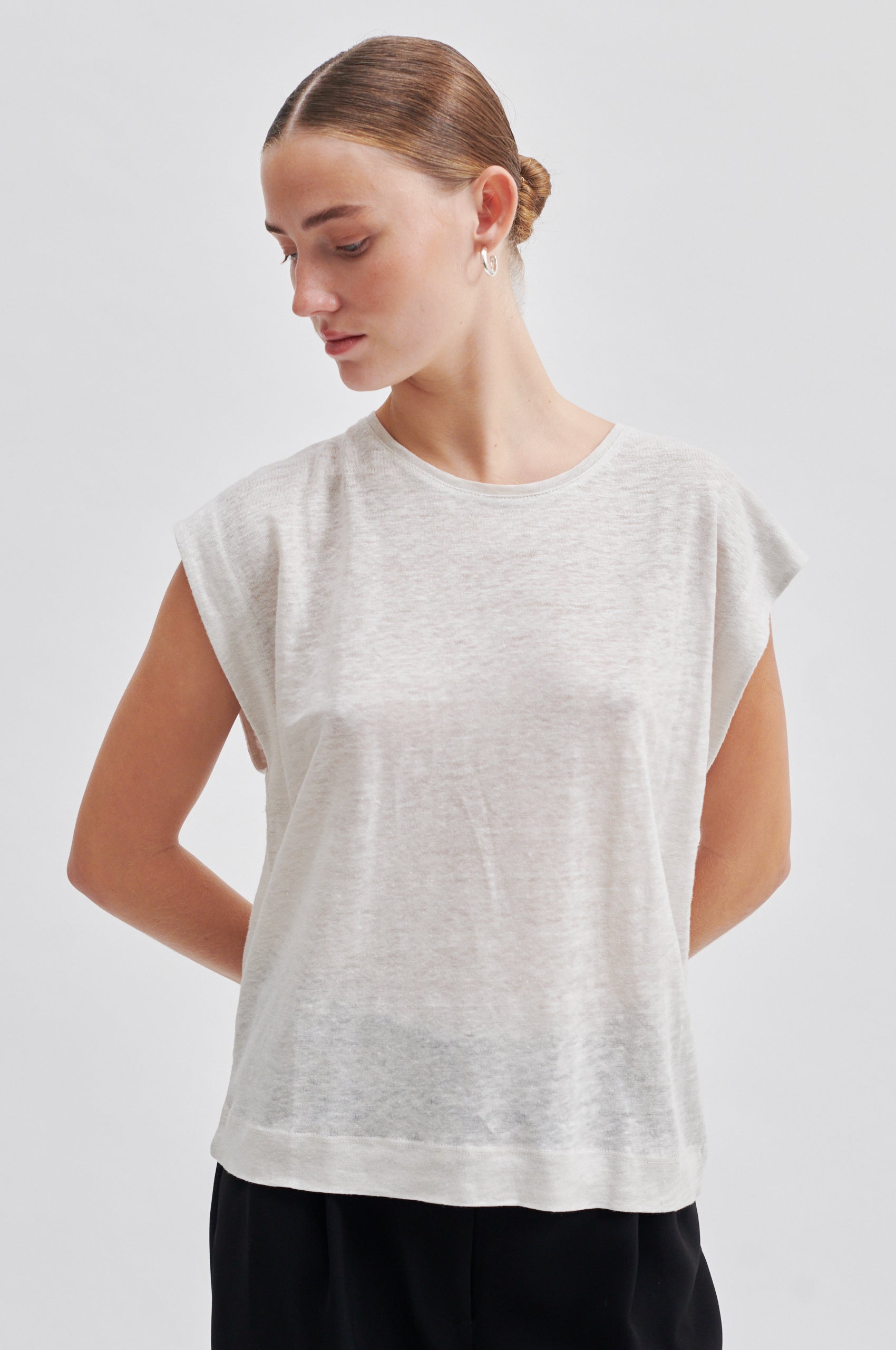 white t-shirt with deep arm holes and round neck