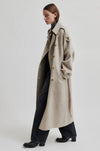 Beige wool double breasted coat with tie waist, asymmetric button fastening and side pockets side view 