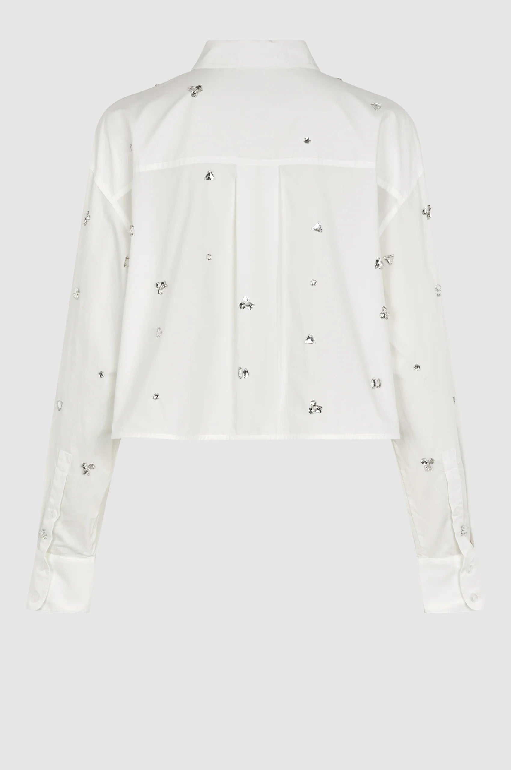 Cropped boxy white long sleeved shirt with scattered sewn on chunky gems