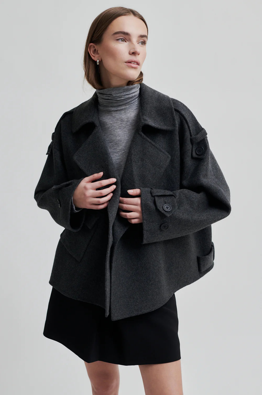 dark grey short jacket with asymmetric button and one side patch pocket