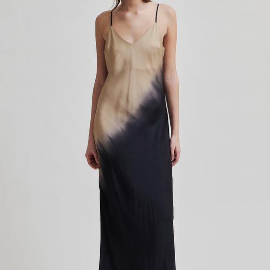 thin strap maxi length viscose slip dress with black and beige two tone design model shot