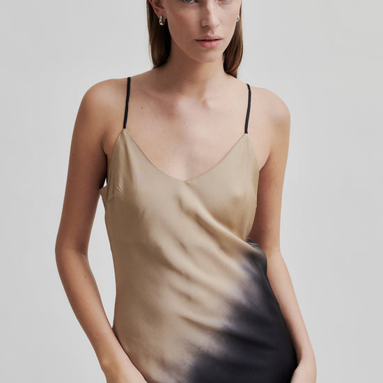 thin strap maxi length viscose slip dress with black and beige two tone design close up