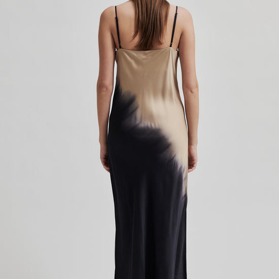 thin strap maxi length viscose slip dress with black and beige two tone design rear view 