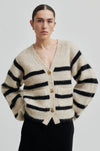 beige mohair blend cardigan with 3 buttons, 2 patch pockets and long sleeves with black stripes model shot