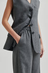 grey melange wide leg trousers with elasticated waist and side pockets close up