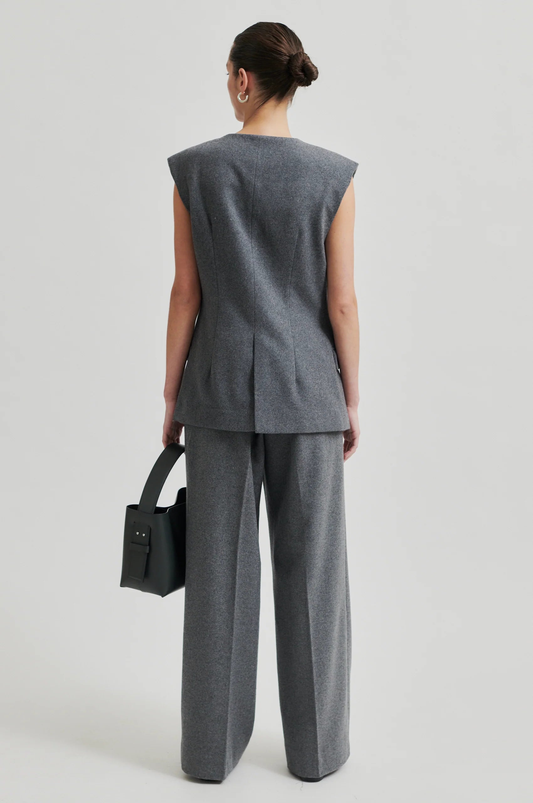 grey melange wide leg trousers with elasticated waist and side pockets  rear view