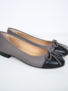Taupe ballet pump with black toe and bow detail