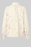 floral lace blouse on sheer background with high neck and buttoned cuffs  rear view 