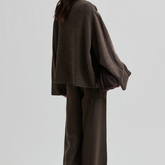 Person wearing a brown outfit with wide-leg pants on a light gray background from Second Female