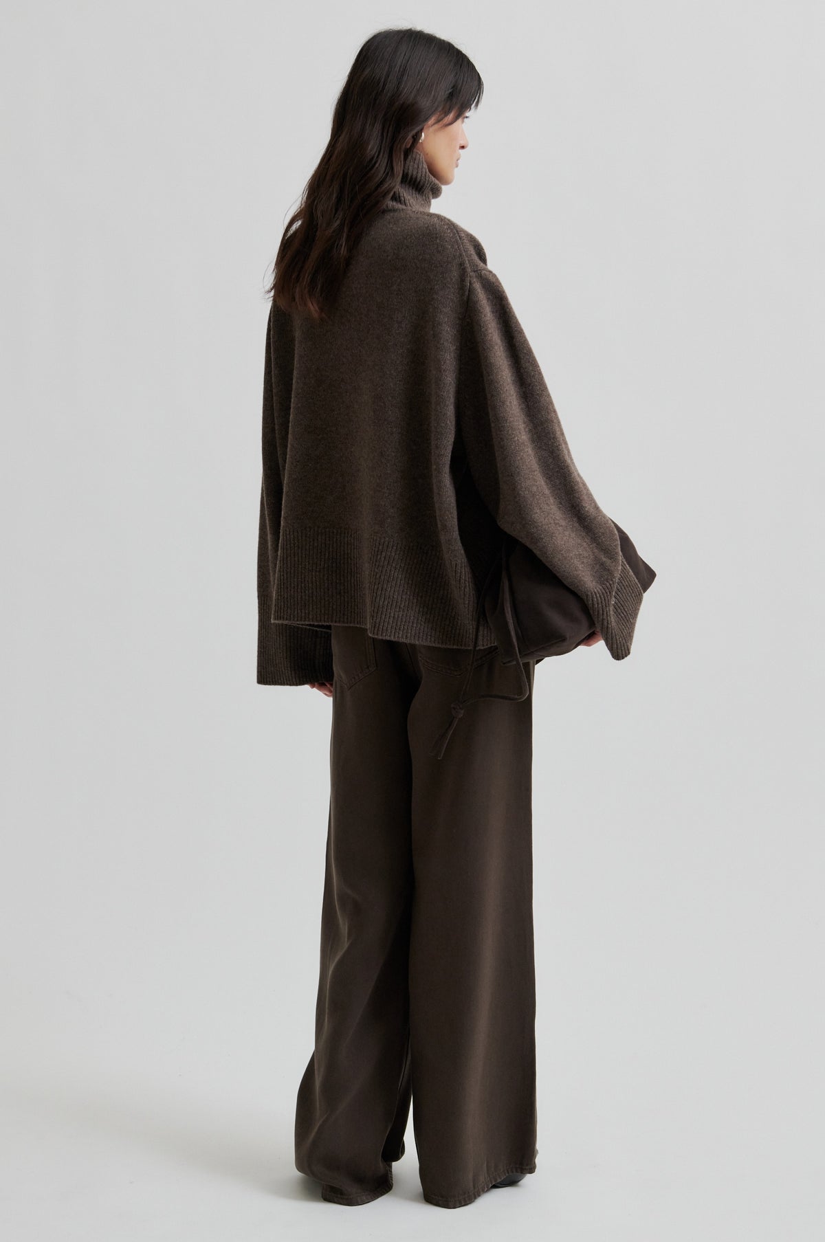Person wearing a brown outfit with wide-leg pants on a light gray background from Second Female