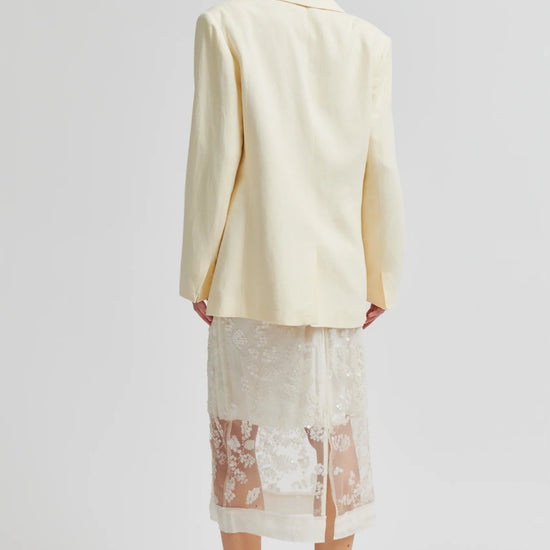 Rear view of Cream blazer worn with lace detail skirt from Second Female
