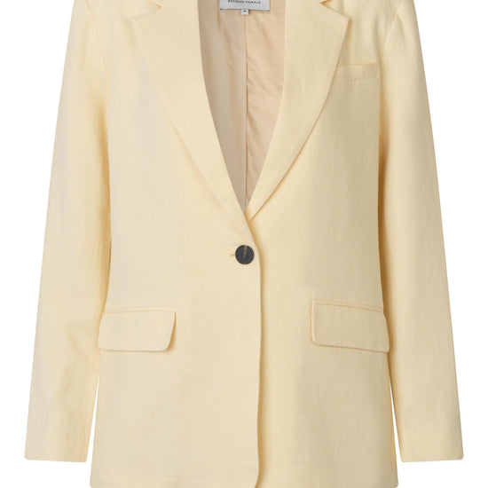 single breasted cream blazer with two front flap pockets from second female