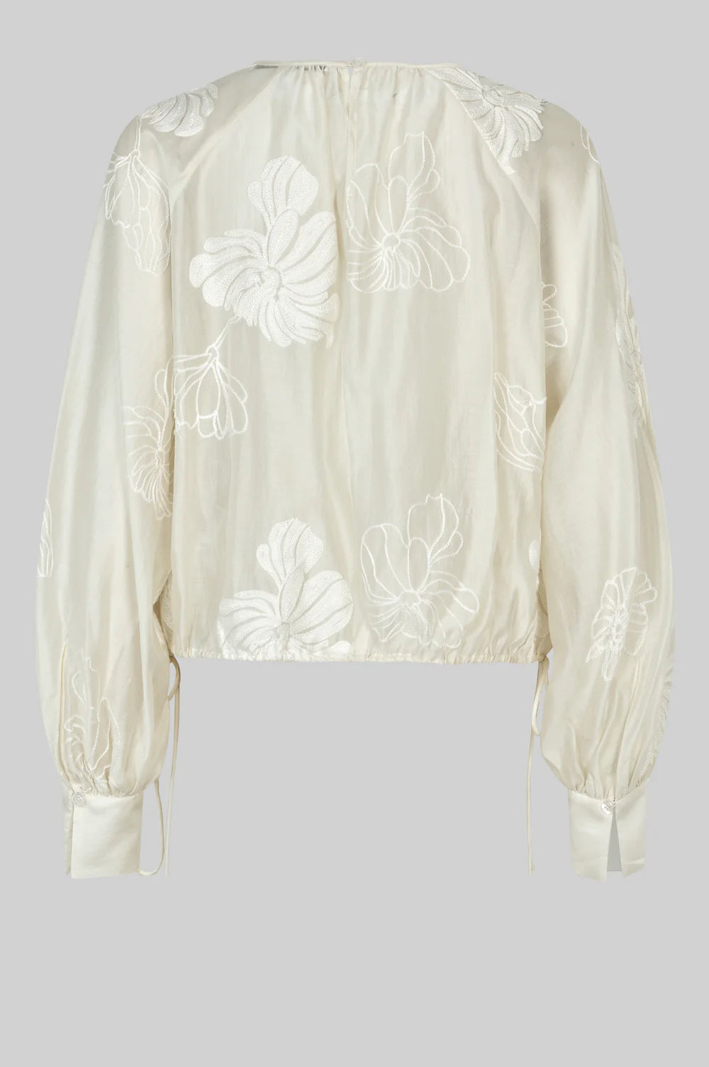 round neck ecru blouse with tonal floral print with long cuffed sleeves rear view