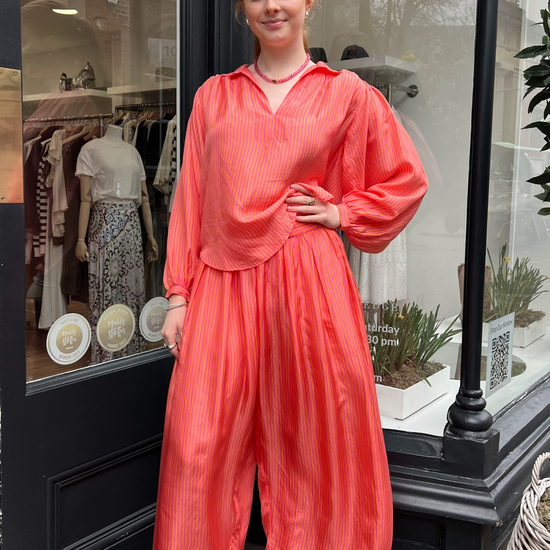 Loose orange and pink stripe trousers