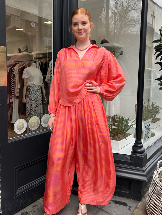 Loose orange and pink stripe trousers