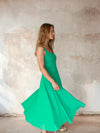 Model shot of green fit and flare dress from Sirens