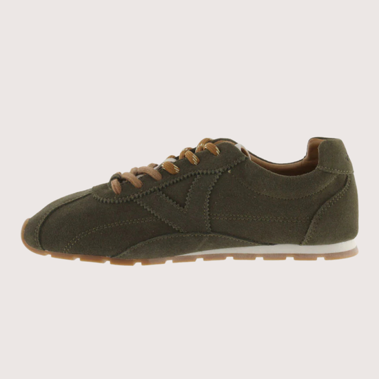 Khaki suede sneaker with beige sole on a plain background