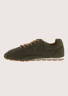 Khaki suede sneaker with beige sole on a plain background