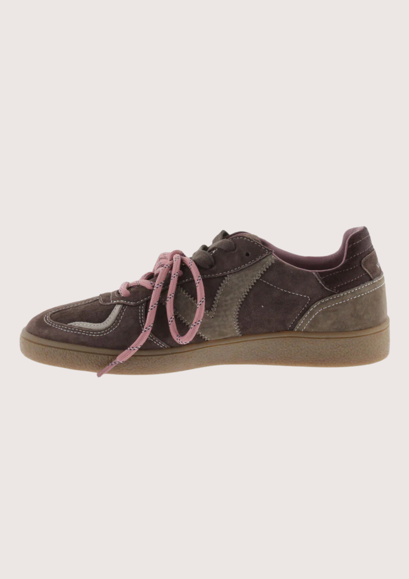 A low-top sneaker in dark brown suede and canvas with dusty pink laces and a tan gum sole, shown from a side profile on a light gray background.