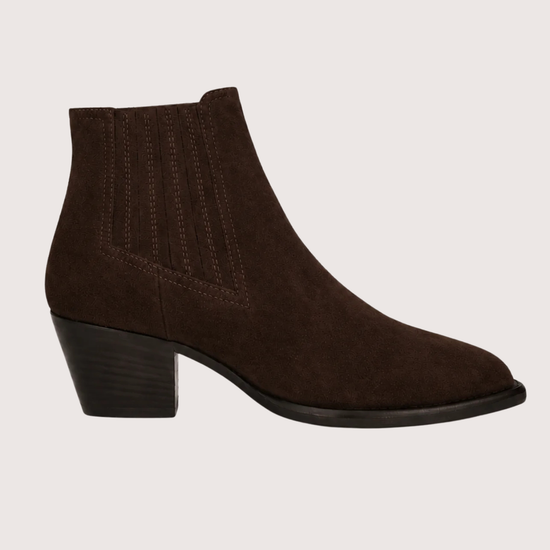 A pair of dark brown suede ankle boots with ribbed elastic side panels and low block heels, displayed against a solid light beige background.